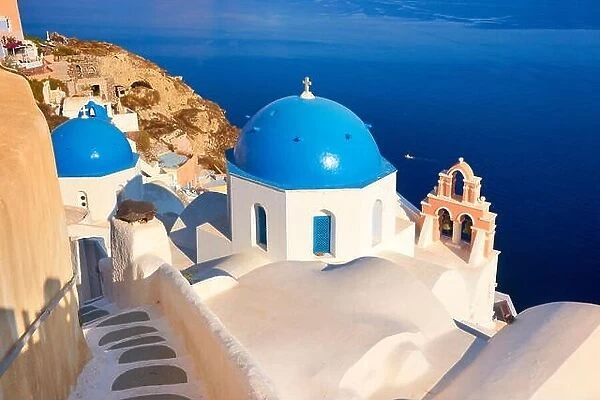 Popular Santorini Caldera landscape with greek white church overlooking the sea, Oia Town, Santorini Island, Greece