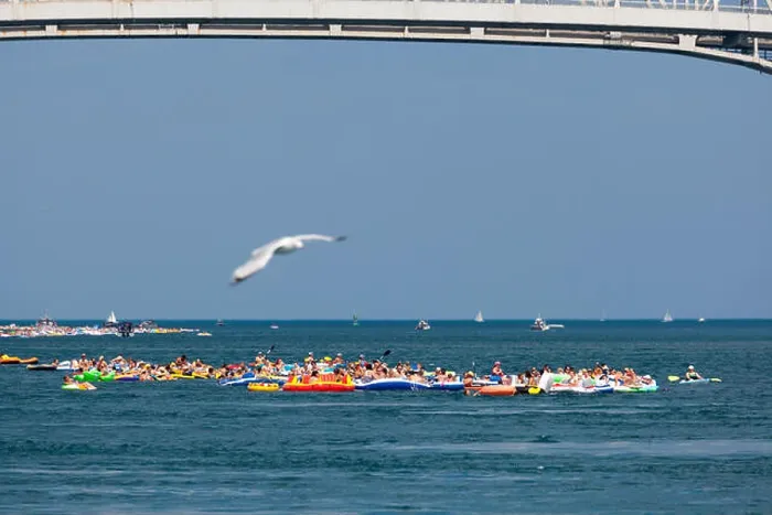 Framed Print : Port Huron, Michigan, USA. Thousands of rafters participated in the annual Port Huron Float Down on the St Framed Print : Port Huron, Michigan, USA. Thousands of rafters participated in the annual Port Huron Float Down on the St