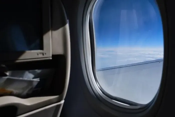 Framed Print : Porthole sky view. Commercial airplane window view from passenger seat Framed Print : Porthole sky view. Commercial airplane window view from passenger seat