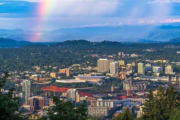 Portland, Oregon, USA downtown cityscape with a sun shower and rainbow