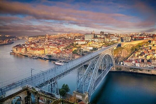 Porto, Portugal. Aerial cityscape image of Porto, Portugal with the Douro River and the Luis I Bridge during sunrise