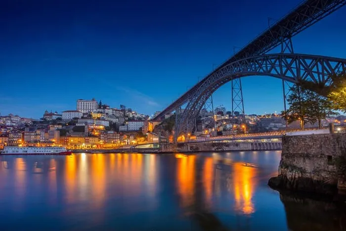 Framed Print : Porto, Portugal. Cityscape image of Porto, Portugal with reflection of the city in the Douro River and the Luis I Bridge during twilight blue hour Framed Print : Porto, Portugal. Cityscape image of Porto, Portugal with reflection of the city in the Douro River and the Luis I Bridge during twilight blue hour