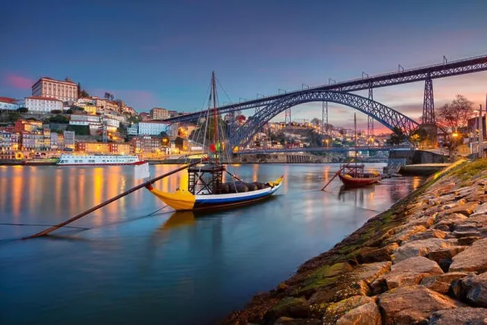 Framed Print : Porto, Portugal. Cityscape image of Porto, Portugal with reflection of the city in the Douro River and the Luis I Bridge during sunrise