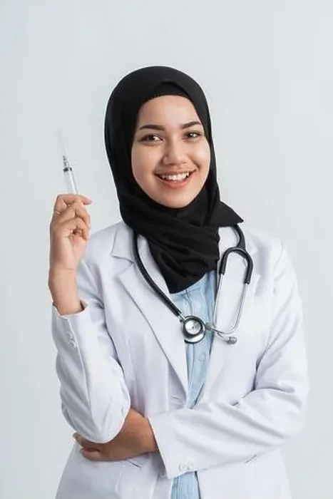 Framed Print : portrait of asian muslim female doctor holding a syringe Framed Print : portrait of asian muslim female doctor holding a syringe