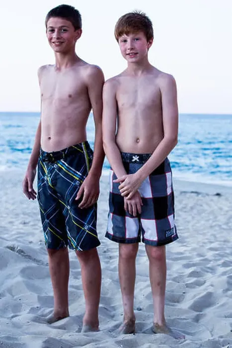 Framed Print : Portrait of two boys standing on beach