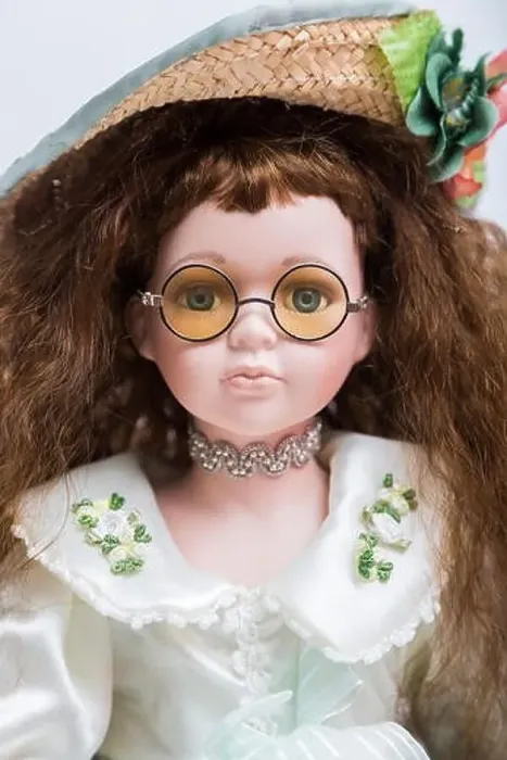 Framed Print : Portrait of a ceramic porcelain handmade vintage doll with yellow glasses Framed Print : Portrait of a ceramic porcelain handmade vintage doll with yellow glasses