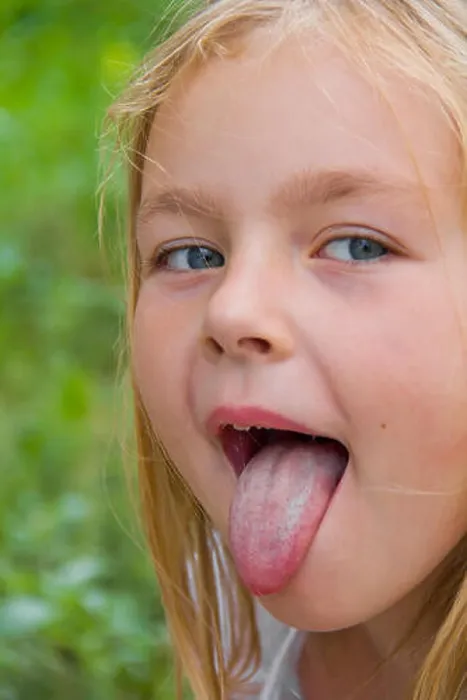 Framed Print : Portrait of cute girl with put out tongue Framed Print : Portrait of cute girl with put out tongue