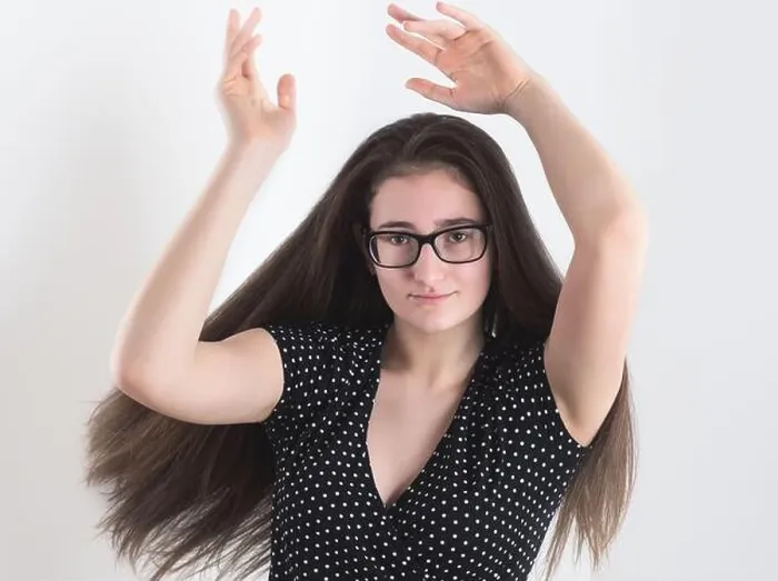 Framed Print : Portrait of a Dancing Bespectacled Long-haired Brunette Teen Girl with Hands in the Air Framed Print : Portrait of a Dancing Bespectacled Long-haired Brunette Teen Girl with Hands in the Air