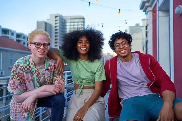 Framed Print : Portrait happy young friends on urban apartment balcony Framed Print : Portrait happy young friends on urban apartment balcony