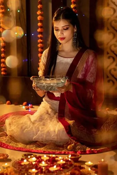 Framed Print : Portrait of an Indian woman holding flowers on a festive occasion. Celebrations at home. Diwali or Christmas Framed Print : Portrait of an Indian woman holding flowers on a festive occasion. Celebrations at home. Diwali or Christmas