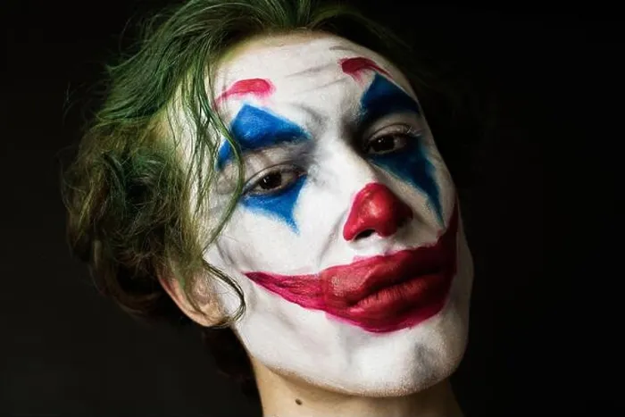 Framed Print : Portrait of a man with clown makeup and green hair Framed Print : Portrait of a man with clown makeup and green hair