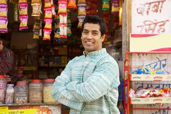 Framed Print : Portrait of a shopkeeper smiling Framed Print : Portrait of a shopkeeper smiling
