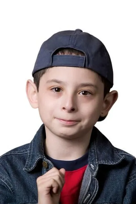 Framed Print : Portrait of a young Caucasian boy wearing a backwards facing baseball cap on a white background Framed Print : Portrait of a young Caucasian boy wearing a backwards facing baseball cap on a white background