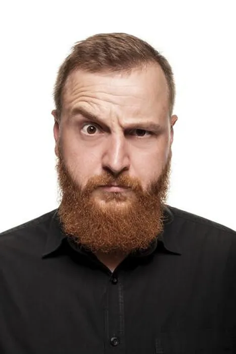 Framed Print : Portrait of a young, chubby, redheaded man with a beard in a black shirt Framed Print : Portrait of a young, chubby, redheaded man with a beard in a black shirt