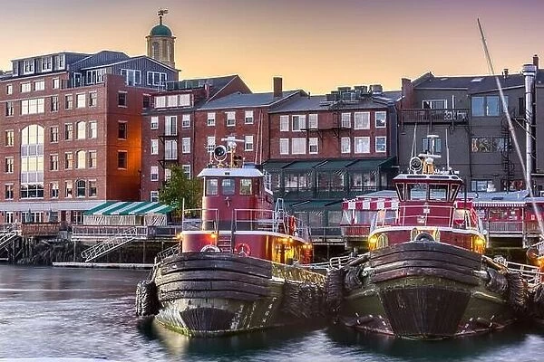 Portsmouth, New Hampshire, USA town cityscape with tugboats in the morning