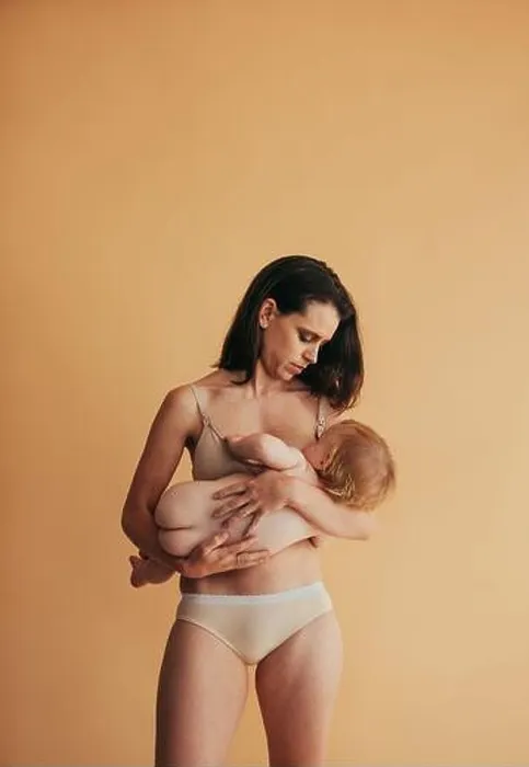Framed Print : Postpartum mother breastfeeding her baby. Mom nursing baby Framed Print : Postpartum mother breastfeeding her baby. Mom nursing baby