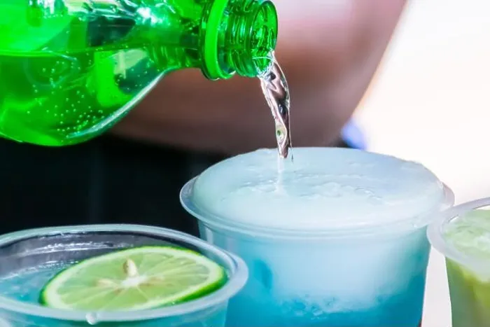 Framed Print : Pouring a soda water into a transparent plastic glass with cold shaved ice inside Framed Print : Pouring a soda water into a transparent plastic glass with cold shaved ice inside