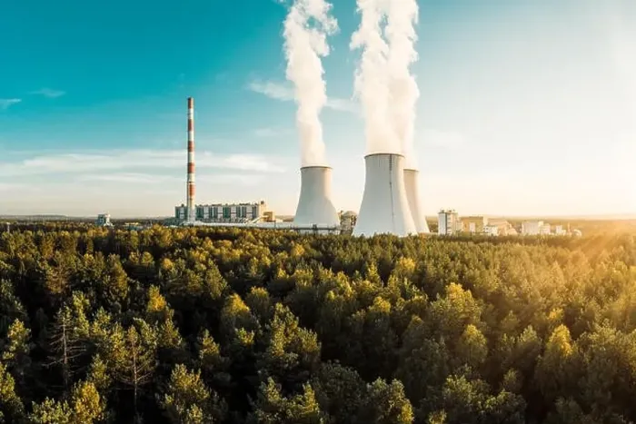 Framed Print : A Power plant with white smoke over it's chimneys Framed Print : A Power plant with white smoke over it's chimneys