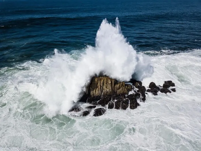 Framed Print : Powerful swells from the Pacific Ocean crash against the rocks just off the coastline of the Monterey peninsula in California