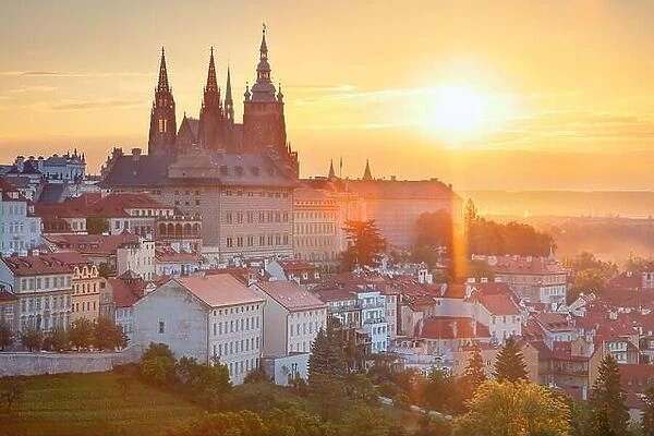 Prague Castle. Aerial cityscape image of Prague, capital city of Czech Republic with St. Vitus Cathedral and Castle District during summer sunrise