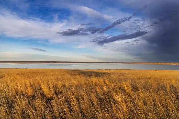Framed Print : Prairie grasslands and Lake Bowdoin at Bowdoin National Wildlife Refuge near Malta, Montana, USA. (Editorial Use Only) Framed Print : Prairie grasslands and Lake Bowdoin at Bowdoin National Wildlife Refuge near Malta, Montana, USA. (Editorial Use Only)