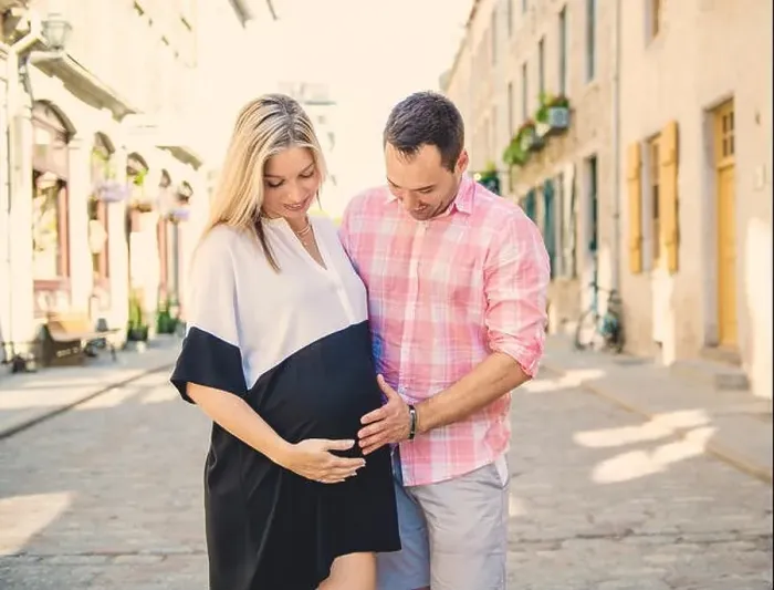 Framed Print : A Pregnant couple portrait outside in the neighborhood