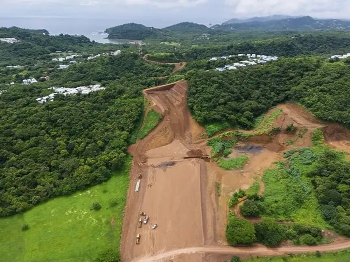 Framed Print : Preparing to build road in green hill jungle aerial drone view Framed Print : Preparing to build road in green hill jungle aerial drone view