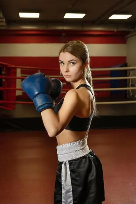 Framed Print : Pretty girl in boxing gloves in a gym shot Framed Print : Pretty girl in boxing gloves in a gym shot