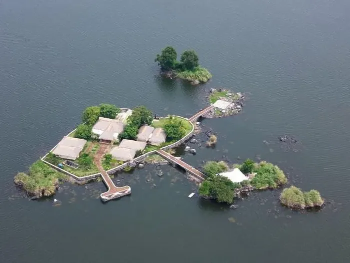 Framed Print : Private island with helicopter pad aerial drone view Framed Print : Private island with helicopter pad aerial drone view