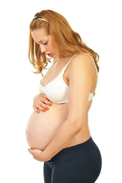 Framed Print : Profile of surprised pregnant woman of her baby movements isolated on white background Framed Print : Profile of surprised pregnant woman of her baby movements isolated on white background