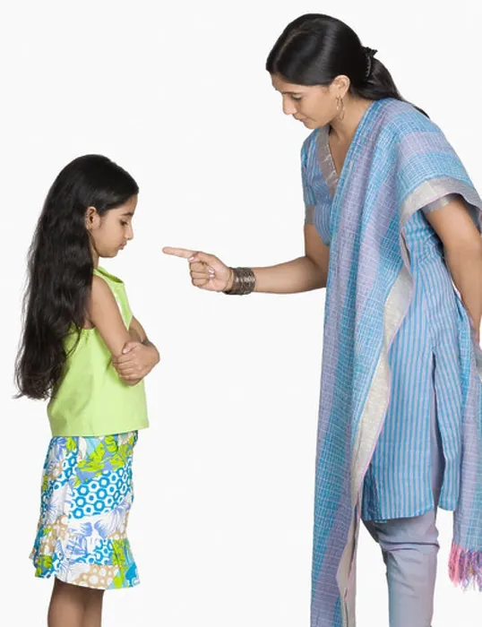 Framed Print : Side profile of a young woman scolding her daughter