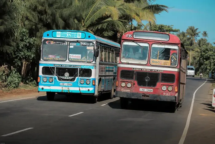 Framed Print : Public buses hazardous overtaking on main road near Unawatuna, Sri Lanka Framed Print : Public buses hazardous overtaking on main road near Unawatuna, Sri Lanka