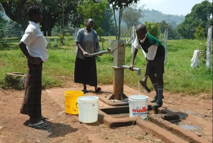 Framed Print : Pumping water at Maseno School Kenya East Africa Framed Print : Pumping water at Maseno School Kenya East Africa