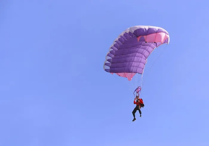 Framed Print : A purple parachute in a blue sky on a sunny day Framed Print : A purple parachute in a blue sky on a sunny day
