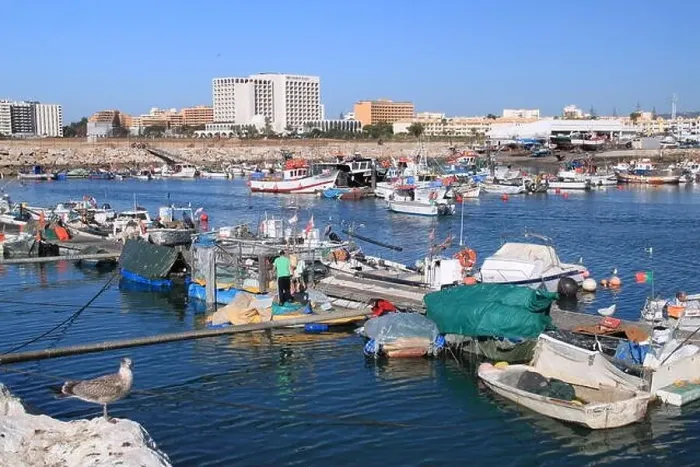 Framed Print : Quarteira fishing harbour, with Crowne Plaza beyond, Vilamoura, Algarve, Portugal, Europe Framed Print : Quarteira fishing harbour, with Crowne Plaza beyond, Vilamoura, Algarve, Portugal, Europe
