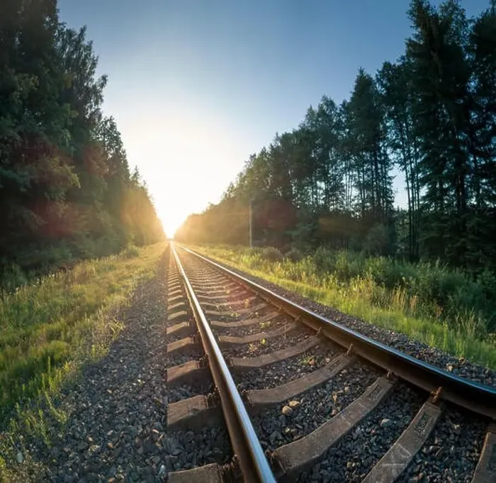 Framed Print : Railway Tracks Leading into Sunset