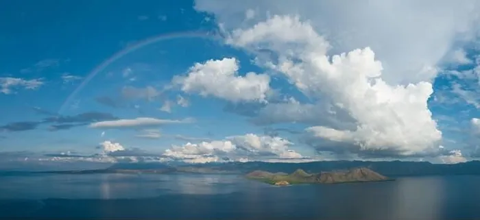Framed Print : A full rainbow stretches across the sky near Flores, Indonesia. This beautiful region has both a wet and a dry season Framed Print : A full rainbow stretches across the sky near Flores, Indonesia. This beautiful region has both a wet and a dry season