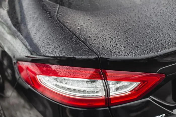 Framed Print : Rainy days, Rain drops on car light, rainy weather, rain background