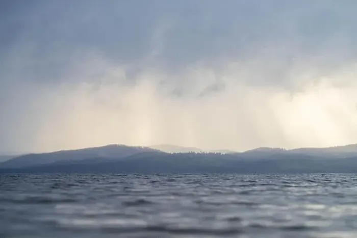 Framed Print : rays through clouds over the water Framed Print : rays through clouds over the water