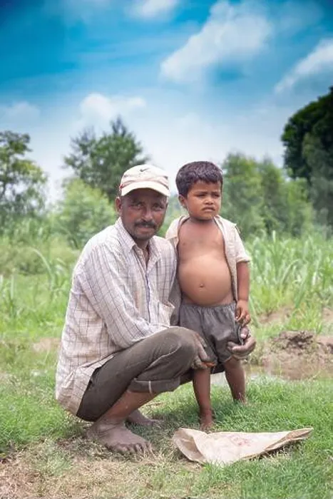 Framed Print : Real people from rural India: Happy father and son. Indian farmer with his son in field. copy space to write text Framed Print : Real people from rural India: Happy father and son. Indian farmer with his son in field. copy space to write text