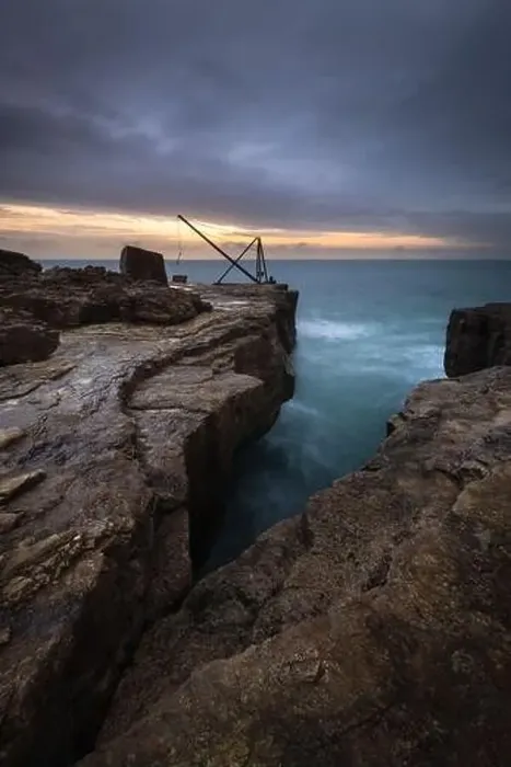 Framed Print : The red crane at Portland Bill Framed Print : The red crane at Portland Bill