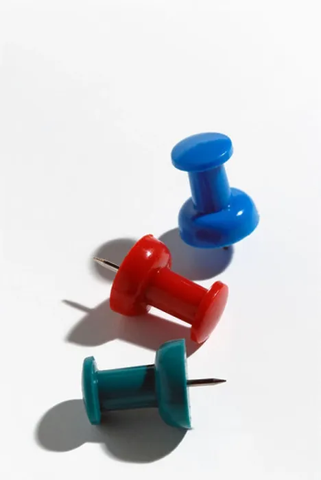 Framed Print : Red green and blue push pins on white paper Framed Print : Red green and blue push pins on white paper