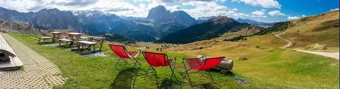 Framed Print : Red lawn chairs with dramtic Mountain background. Dolomites in European Alps. Gardena Pass, Italy. Vacation Theme Framed Print : Red lawn chairs with dramtic Mountain background. Dolomites in European Alps. Gardena Pass, Italy. Vacation Theme