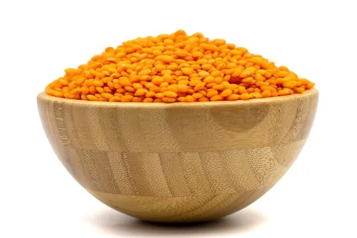 Framed Print : Red lentils isolated on white background. Raw red lentils in wooden bowl Framed Print : Red lentils isolated on white background. Raw red lentils in wooden bowl