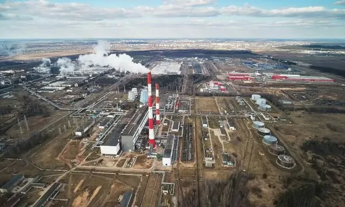 Framed Print : Red pipe with white fumes from factory above drone view Framed Print : Red pipe with white fumes from factory above drone view