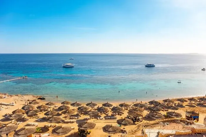 Framed Print : Red sea beach from aerial top view. Tourists relaxing under umbrellas on luxury resort, Egypt Framed Print : Red sea beach from aerial top view. Tourists relaxing under umbrellas on luxury resort, Egypt