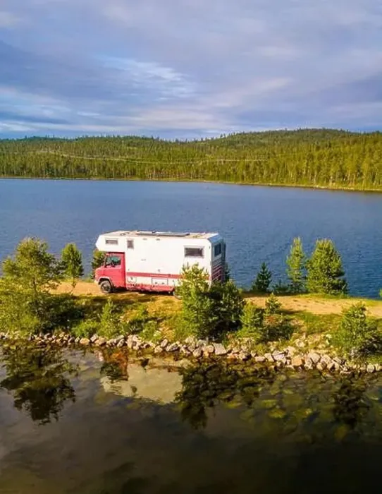 Framed Print : A red and white camper van is parked on the shore of a tranquil lake, surrounded by lush greenery and a clear blue sky Framed Print : A red and white camper van is parked on the shore of a tranquil lake, surrounded by lush greenery and a clear blue sky