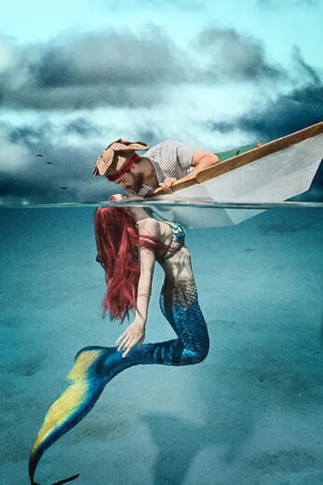 Framed Print : Redhead mermaid kissing a pirate in his boat Framed Print : Redhead mermaid kissing a pirate in his boat