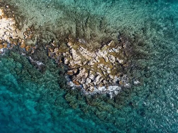 Framed Print : Reefs at the middle of the sea from the top, photo shoot from a drone in a sunny day Framed Print : Reefs at the middle of the sea from the top, photo shoot from a drone in a sunny day