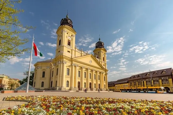 Framed Print : Reformed Great Church in Debrecen city, Hungary. Old city center with statues and flower garden Framed Print : Reformed Great Church in Debrecen city, Hungary. Old city center with statues and flower garden